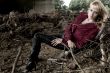 Paris Hilton look-a-like laying between dead trees