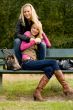 Happy sisters on a bench