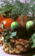 Basket with cucumbers and tomatoes