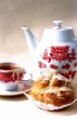 Biscuit, cup of coffee and coffee-pot
