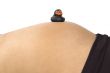 30 weeks pregnant teenager with black duck on her belly