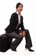 Woman sitting on luggage