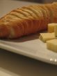 Bread and cheese on a white plate close-up