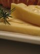 Bread and cheese on a white plate close-up