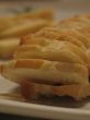 Bread and cheese on a white plate close-up