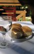 bread and water on a restaurant table
