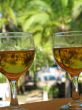 two full beer glasses by the pool