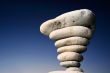 Stack of pebbles against blue