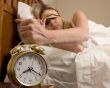 Woman and alarm clock