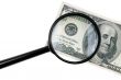 isolated magnifier with dollars