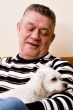 Grandfather giving his dog a loving look