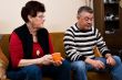 Senior couple drinking cofee in the livingroom