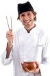happy chef holding bowl and chopsticks