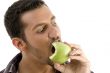 man eating green apple
