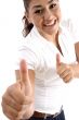smiling woman showing good luck sign