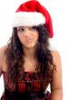 woman with christmas hat making face