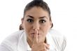 woman instructing to be silent
