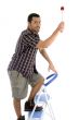 young guy holding painting brush