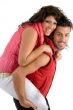 woman riding piggy back on man