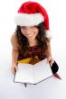smiling student with christmas hat and books