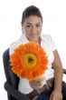 lovely girl showing orange gerbera flower