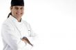 happy male chef posing in front of camera