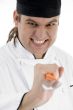 male chef showing kitchen tool facial expressions