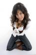 sexy teenager sitting on floor with legs crossed