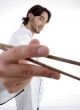 young fellow in chef uniform holding chopsticks