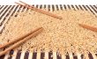 Rice and chopsticks on bamboo carpet