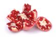 Broken pomegranate on white