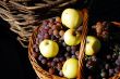 Basket with grapes and apples