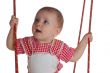 happy little kid playing with swing