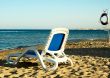 Deck-chair next  to the sea.