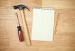 Pad of Paper, Pencil, Hammer and Screwdriver