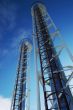 Industrial pipes and ladders on the blue sky