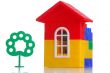 construction of a house, and green tree