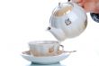 flowing tea into cup