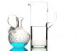 glass utensil with water and blue liquid