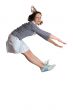 Happy energetic cute girl jumping into the air