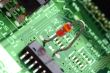 close-up chip on green motherboard