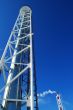 Industrial pipes and ladders on the blue sky