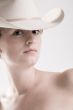 Sexy portrait of a red haired Cowgirl