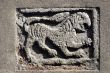 Ancient stone panel on a church in Tuscany