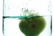 Splashing green apple