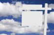 Blank Real Estate Sign on Clouds & Sky Background