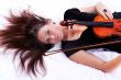 Beautiful brunette girl with violin