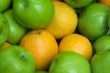 Apple and oranges at the market stand