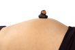 30 weeks pregnant teenager with black duck on her belly