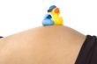 30 weeks pregnant teenager with two ducks on her belly